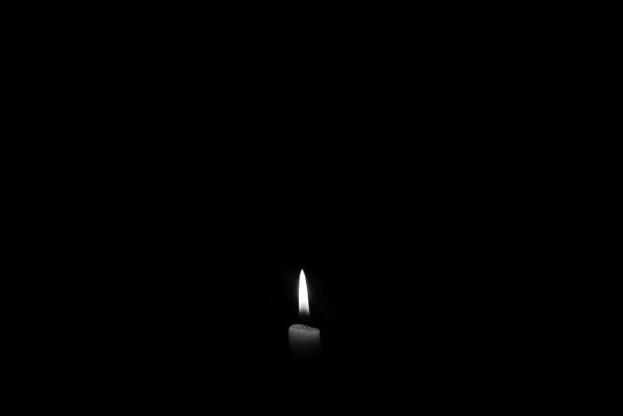 Dark candle. No electricity. dark photo