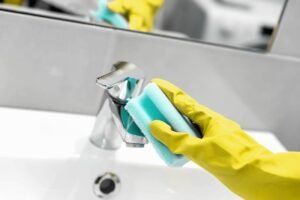 woman chores bathroom cleaning water tap