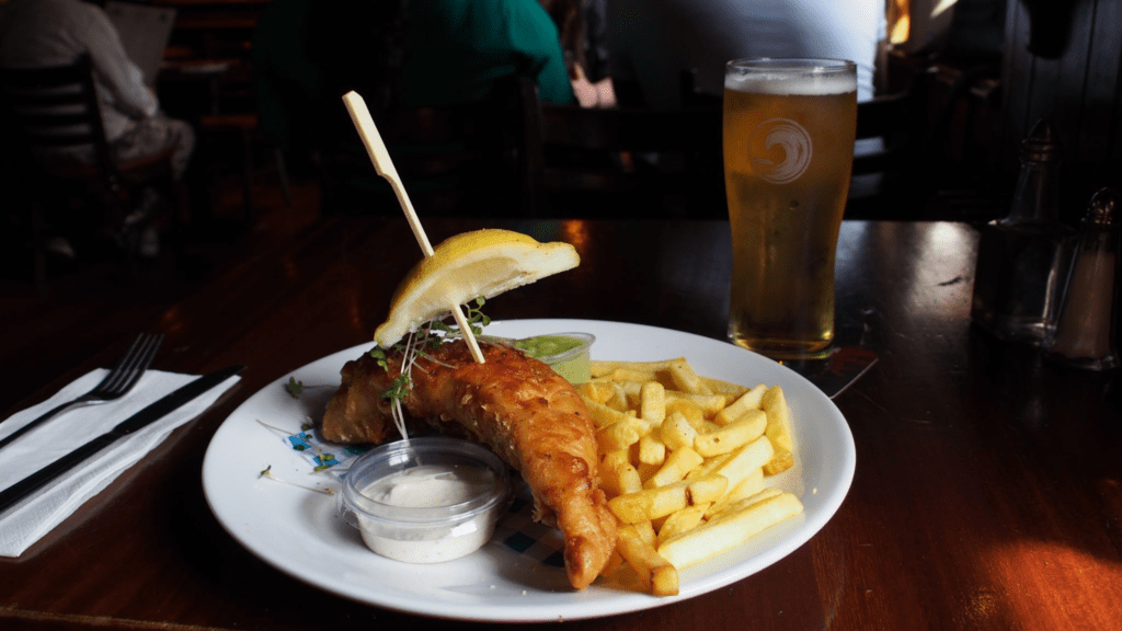 Fish and chips served with tartare sauce and mushy peas in The Bloody Stream. Image by author.