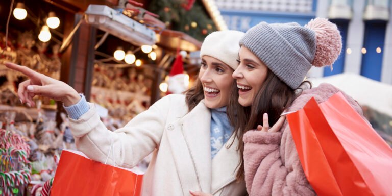 women christmas retail christmas market scaled e1732557425492